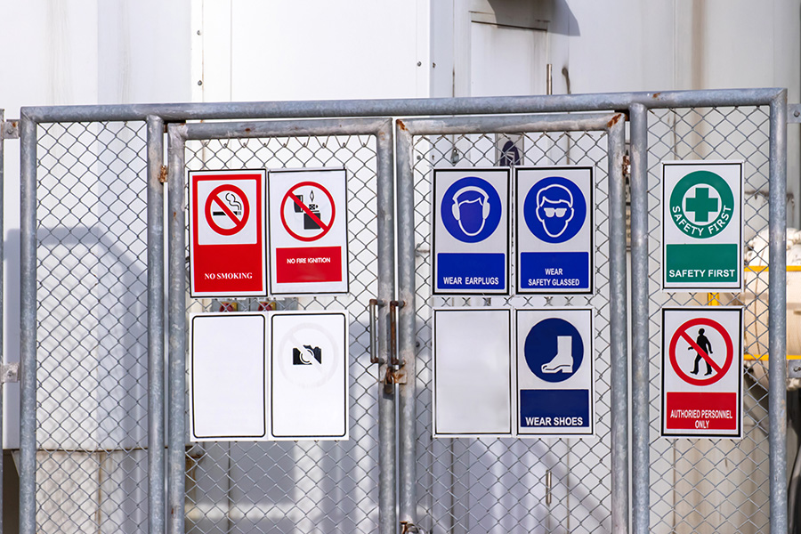 Liquid oxygen tank in factory with warning label for safety cont